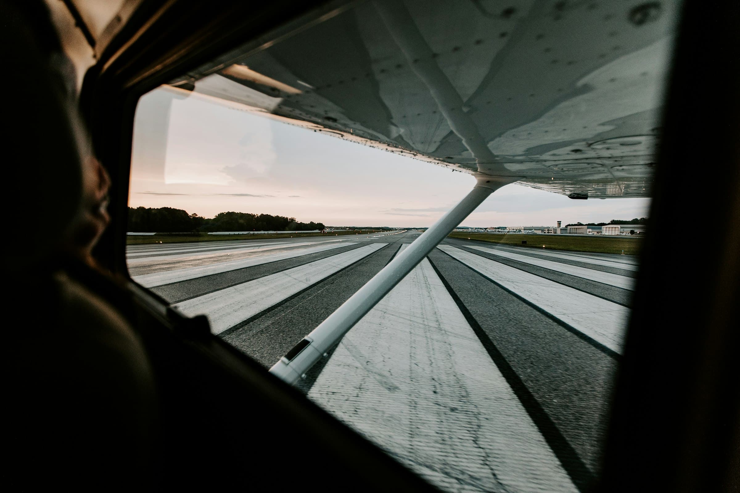 airplane wing and runway photo